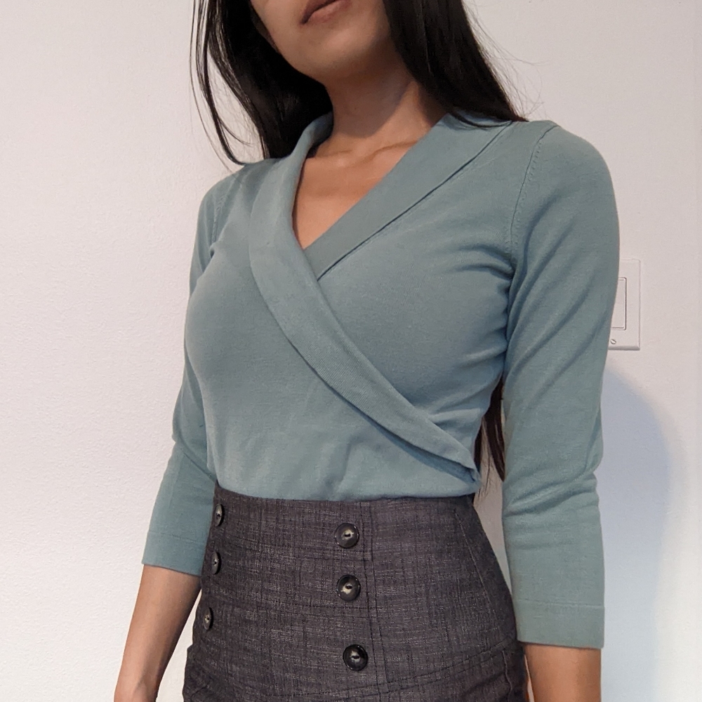 Light teal blue cross over knit top